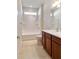 Bright bathroom with tiled floors and a bathtub-shower combination at 9858 Sw 75Th Street Rd, Ocala, FL 34481