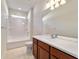 Bathroom featuring stylish vanity with sink and bathtub-shower combination at 9858 Sw 75Th Street Rd, Ocala, FL 34481