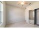 Carpeted bedroom with closet and large windows at 9858 Sw 75Th Street Rd, Ocala, FL 34481