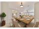 Elegant dining room area with stylish furniture and lighting, adjacent to the living spaces at 9858 Sw 75Th Street Rd, Ocala, FL 34481