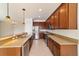 Kitchen with granite counters, stainless steel appliances, and dark wood cabinets at 9858 Sw 75Th Street Rd, Ocala, FL 34481