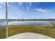 Scenic lake view from the property showcasing clear blue skies and tranquil water at 9858 Sw 75Th Street Rd, Ocala, FL 34481