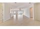 Spacious living room with tile flooring and large glass doors leading to a screened-in porch at 9858 Sw 75Th Street Rd, Ocala, FL 34481