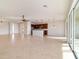 Bright, open-concept living space with tile floors connects seamlessly to the kitchen at 9858 Sw 75Th Street Rd, Ocala, FL 34481