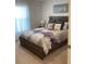 Bedroom with full-size bed, dresser, and window coverings at 10 Spruce Pass, Ocala, FL 34472