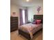 Charming bedroom with twin bed, dresser, and butterfly theme at 10 Spruce Pass, Ocala, FL 34472