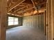 A new construction interior with concrete floors, block walls and wood framing, offering a glimpse of the room's structure at 10 Spruce Pass, Ocala, FL 34472