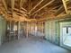 A new construction interior featuring wood framing and block walls, offering a glimpse of a home's structure at 10 Spruce Pass, Ocala, FL 34472