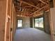 A new construction interior with concrete floors, block walls and wood framing, offering a glimpse of the room's structure at 10 Spruce Pass, Ocala, FL 34472