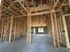 A new construction interior featuring wood framing and block walls, offering a glimpse of a home's structure at 10 Spruce Pass, Ocala, FL 34472