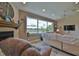 Bright living room showcasing a large window with scenic views at 10170 Se 106Th Ln, Belleview, FL 34420