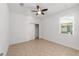 Bright bedroom with ceiling fan and closet at 10277 Sw 96Th Loop, Ocala, FL 34481