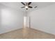 Well-lit bedroom with ceiling fan and closet at 10277 Sw 96Th Loop, Ocala, FL 34481