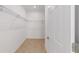 Spacious walk-in closet with wire shelving at 10277 Sw 96Th Loop, Ocala, FL 34481