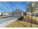 Two-car garage and a paved driveway at 10277 Sw 96Th Loop, Ocala, FL 34481