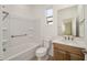 Well-lit bathroom with tub, shower and vanity at 10306 Sw 99Th Ln, Ocala, FL 34481