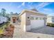 Beautiful home exterior featuring a stone driveway and well-maintained landscaping, enhancing its curb appeal in the neighborhood at 10306 Sw 99Th Ln, Ocala, FL 34481