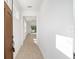 Bright foyer with tan tile flooring and a view to the living room at 10306 Sw 99Th Ln, Ocala, FL 34481