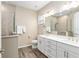 Elegant bathroom with double vanity and walk-in shower at 10339 Sw 96Th Ln, Ocala, FL 34481