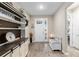 Bright entryway with built-in shelving and bench at 10339 Sw 96Th Ln, Ocala, FL 34481