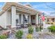 Inviting front porch with rocking chairs and stone accents at 10339 Sw 96Th Ln, Ocala, FL 34481