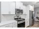 Modern kitchen with stainless steel appliances and white cabinets at 10339 Sw 96Th Ln, Ocala, FL 34481