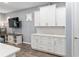 White kitchen cabinets and quartz countertops at 10339 Sw 96Th Ln, Ocala, FL 34481