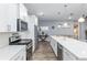 Modern kitchen with white cabinets and stainless steel appliances at 10339 Sw 96Th Ln, Ocala, FL 34481