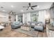 Open living space with gray sofas, coffee table, and sliding glass doors at 10339 Sw 96Th Ln, Ocala, FL 34481