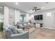 Relaxing living room with gray sectional sofa and wood coffee table at 10339 Sw 96Th Ln, Ocala, FL 34481