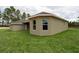 A view of the backyard showing the side of the house at 12217 Sw 67Th Ln, Ocala, FL 34481