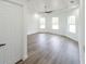 Bedroom featuring a modern ceiling fan and bright windows at 12217 Sw 67Th Ln, Ocala, FL 34481