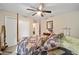 Main bedroom with a post bed and ample closet space at 13700 Sw 71St Ln, Ocala, FL 34481