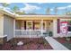 Front porch with rocking chairs and American flag at 13700 Sw 71St Ln, Ocala, FL 34481