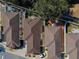 Aerial view of community of tan houses with brown roofs at 17074 Se 75Th Wickson Ct, The Villages, FL 32162