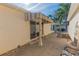 Relaxing backyard patio with striped awning and small fountain at 17074 Se 75Th Wickson Ct, The Villages, FL 32162