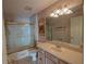 Clean bathroom with tub, shower, and vanity at 17074 Se 75Th Wickson Ct, The Villages, FL 32162