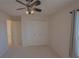 Bright bedroom with carpet floors, ceiling fan and closet at 17074 Se 75Th Wickson Ct, The Villages, FL 32162