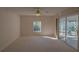 Sunlit bedroom featuring a window and sliding door at 17074 Se 75Th Wickson Ct, The Villages, FL 32162