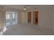 Bedroom with sliding doors, walk-in closet, and bathroom access at 17074 Se 75Th Wickson Ct, The Villages, FL 32162