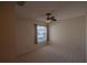 Cozy bedroom with carpet floors, ceiling fan and window at 17074 Se 75Th Wickson Ct, The Villages, FL 32162