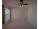 Well-lit bedroom with large window and ceiling fan at 17074 Se 75Th Wickson Ct, The Villages, FL 32162