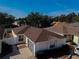 Tan one-story house with brown roof and landscaped yard at 17074 Se 75Th Wickson Ct, The Villages, FL 32162