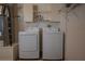 Clean laundry area with washer and dryer in garage at 17074 Se 75Th Wickson Ct, The Villages, FL 32162