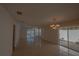 Bright living room with tile floors and sliding glass doors leading to a patio at 17074 Se 75Th Wickson Ct, The Villages, FL 32162