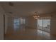 Bright living room with tile floors and sliding glass doors to a patio at 17074 Se 75Th Wickson Ct, The Villages, FL 32162