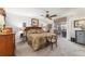 Spacious Primary bedroom with king-size bed and private access to patio at 17470 Se 115Th Terrace Rd, Summerfield, FL 34491