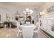 Bright dining room with a round table and chairs near the kitchen at 17470 Se 115Th Terrace Rd, Summerfield, FL 34491