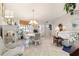 Bright dining room with white table and chairs at 17470 Se 115Th Terrace Rd, Summerfield, FL 34491