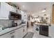 Modern kitchen with white cabinets and granite countertops at 17470 Se 115Th Terrace Rd, Summerfield, FL 34491